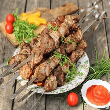 Signature Kebabs - Traditional Turkish kebabs including Adana, Iskender, and döner - grilled to perfection at Pita House Long Island Medford NY
